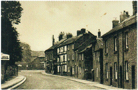 WH West End West side 1 - The white-fronted Sheaf on West End, with the barn and stable-block of Church Farm in the background.